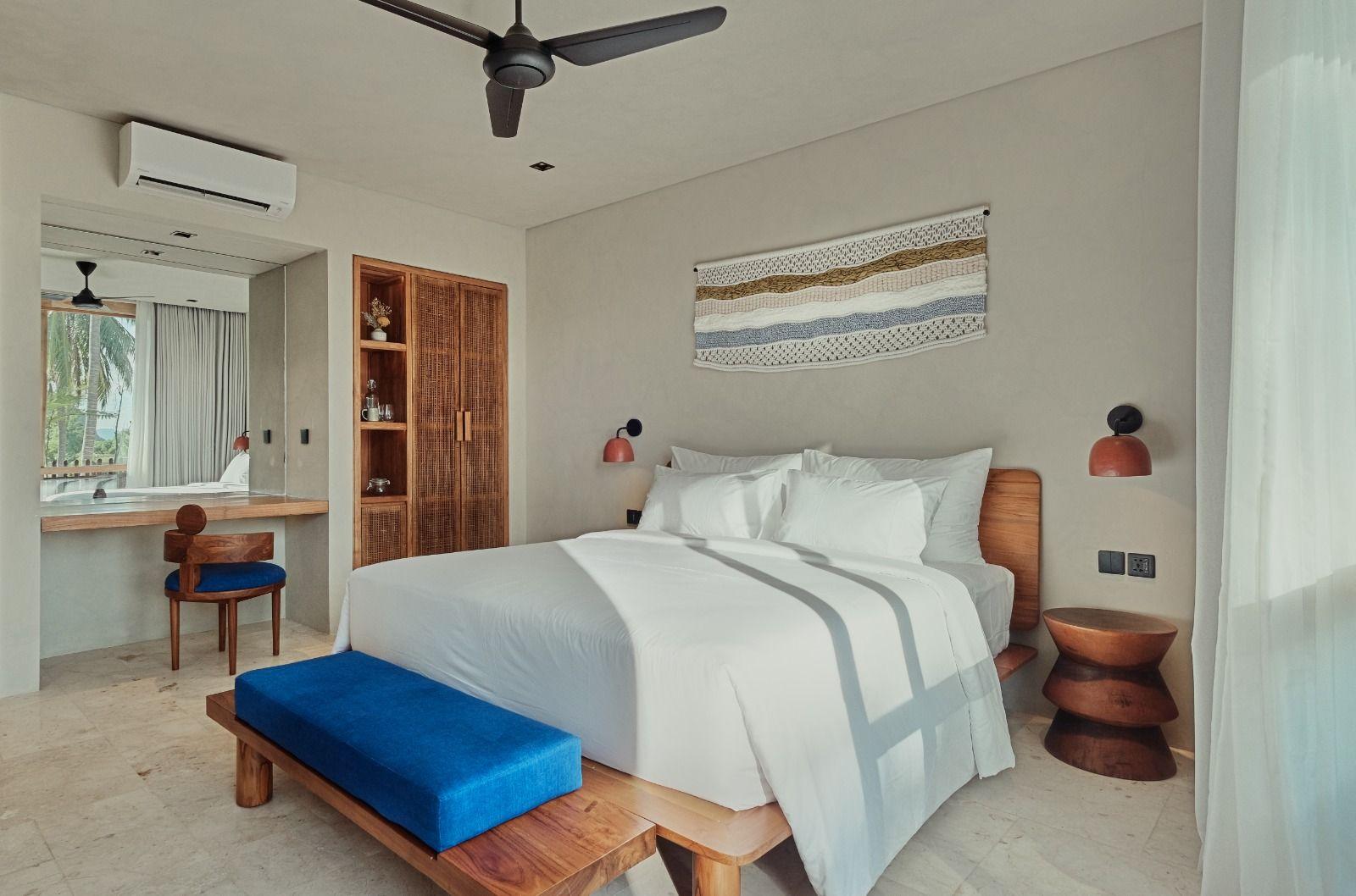 Pool Side Room first floor, including modern teak furniture, dedicated work area.