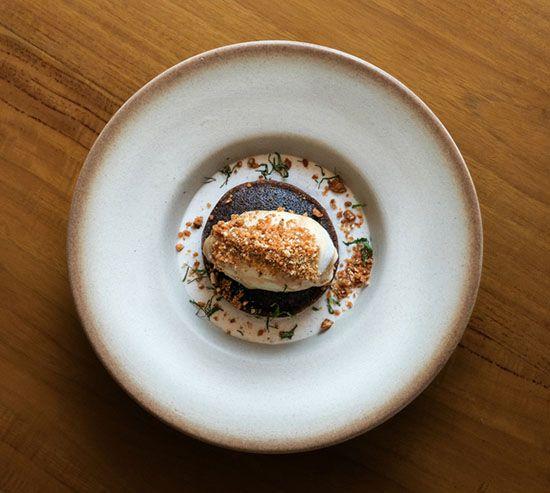 modern Indonesian dessert Black rice pudding with pandan and caramel ice cream